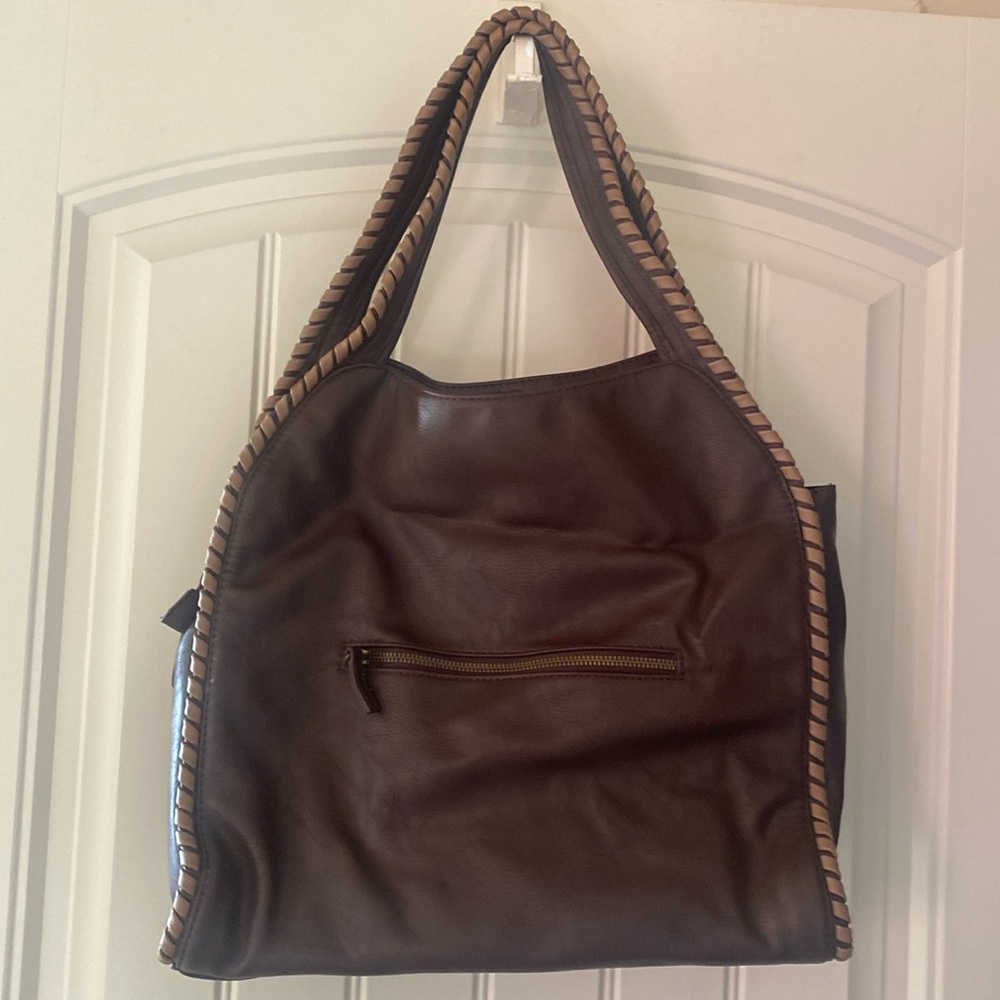 Beautiful brown with beige trim oversized shoulder bag is gently used.